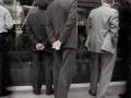 Men watch the board at Australian Stock Exchange 1996 Photograph Robert Young